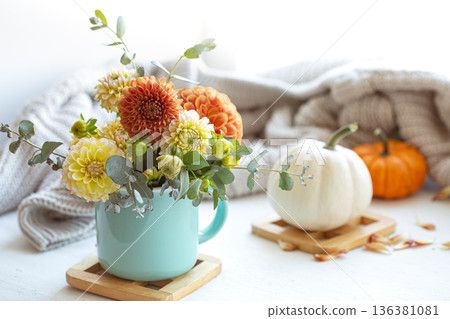 Spring composition with chrysanthemum flowers on a blurred background. Spring composition with chrysanthemum flowers on a blurred background. 136381081