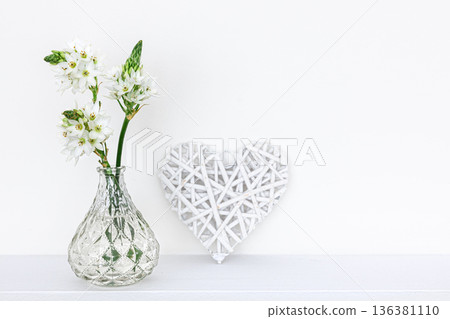 Spring flowers in glass vases isolated on white background. 136381110