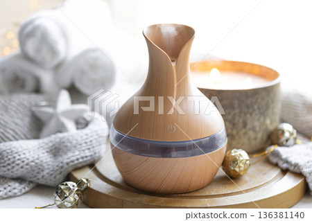 Still life with an aroma diffuser for moisturizing the air and winter decor. 136381140
