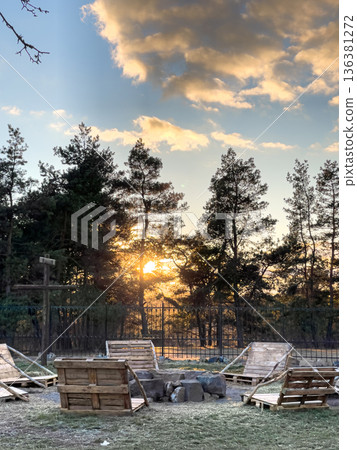 Sunset among the pines, landscape of the park. Sunset among the pines, landscape of the park. 136381272