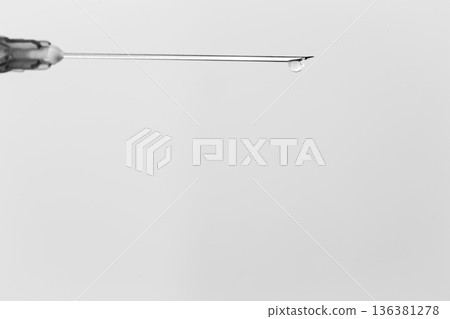 Syringe with drop isolated on white background Syringe with drop isolated on white background 136381278