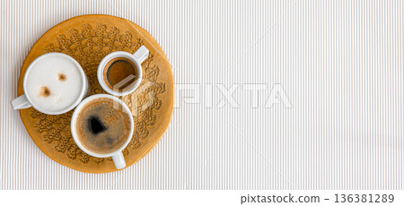 Three cups of coffee on a white texture background, flat lay. Three cups of coffee on a white texture background, flat lay. 136381289