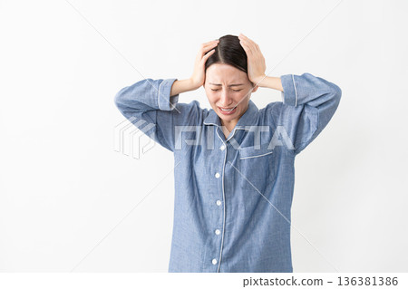 Woman wearing pajamas Lifestyle image Woman wearing pajamas Lifestyle image 136381386