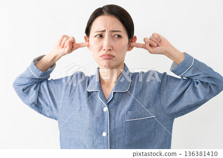 Woman wearing pajamas Lifestyle image 136381410