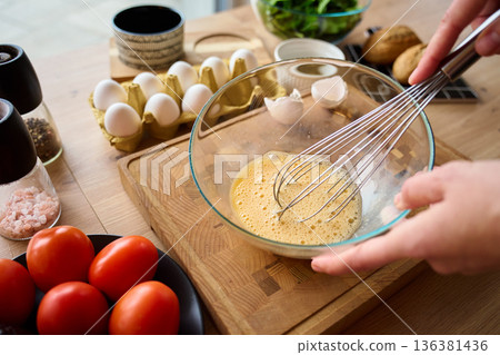 Whisking Eggs with Fresh Ingredients for Healthy Breakfast 136381436