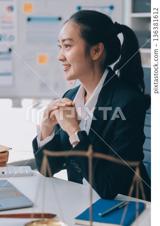 Lawyer explained to the client about the law that must be brought against the court case. Lawyer explained to the client about the law that must be brought against the court case. 136381612