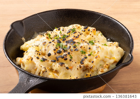 Corn, potato salad, baked cheese 136381643