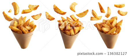 Batata Harra spicy potato wedges seasoned with herbs, garlic, chili served in brown paper cone, isolated on white background Batata Harra spicy potato wedges seasoned with herbs, garlic, chili served in brown paper cone, isolated on white background 136382127