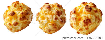 Small cheesy bread ball with golden crust and holes, isolated on white background, concept of Brazil Pao de Queijo food 136382189