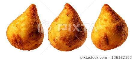 Fried Brazilian coxinhas cone snack filled shredded chicken cheese with golden crispy texture isolated on white background Fried Brazilian coxinhas cone snack filled shredded chicken cheese with golden crispy texture isolated on white background 136382193