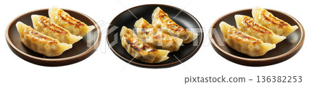 Golden pan-fried Japanese gyoza dumplings served on plate, isolated on white background, concept of Asian cuisine 136382253
