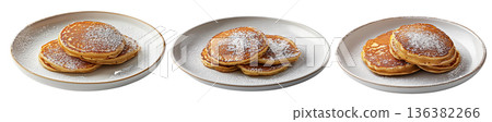 Stack of fluffy golden pancakes sprinkled with powdered sugar on a ceramic plate, isolated on white background Stack of fluffy golden pancakes sprinkled with powdered sugar on a ceramic plate, isolated on white background 136382266