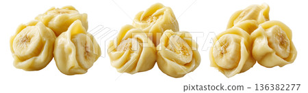 Set of Steamed Banana dumplings with intricate twisted edges, isolated on white background. Concept of Asian cuisine and food art 136382277