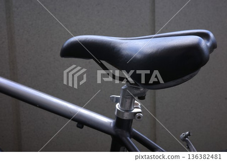 Black saddle and seat post of a cross bike 136382481