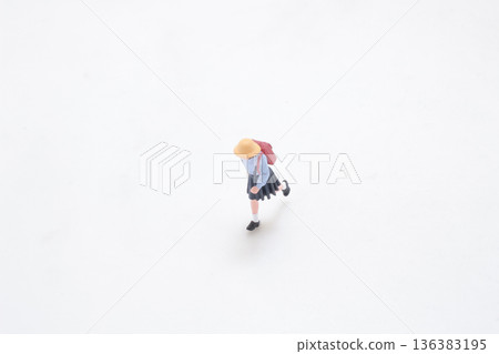 Miniature student runs forward across clean white studio background Miniature student runs forward across clean white studio background 136383195