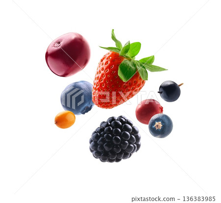 Vivid berry display. Brightly lit assortment of floating berries. Fresh assorted berries suspended against white background for advertising Vivid berry display. Brightly lit assortment of floating berries. Fresh assorted berries suspended against white background for advertising 136383985