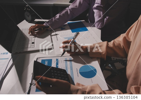 Above table with finance papers, graphs and big data during teamwork meeting with accounting or marketing team discussing budget, strategy or growth development. Closeup of SEO team doing research Above table with finance papers, graphs and big data during teamwork meeting with accounting or marketing team discussing budget, strategy or growth development. Closeup of SEO team doing research 136385104