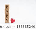"BABY" wooden building blocks and a red heart, inspired by babies, white background, vertical composition 136385240