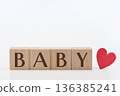 Wooden "BABY" building blocks and a red heart, inspired by babies, white background, horizontal composition 136385241