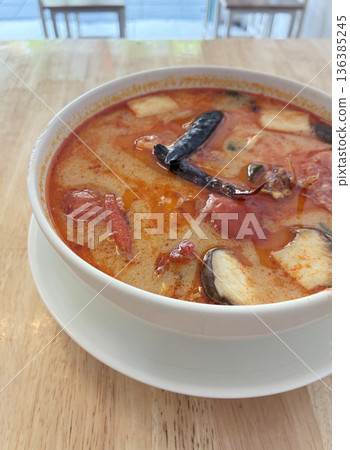 Spicy Thai Tom Yum Soup with Shrimp and Mushrooms in White Bowl Spicy Thai Tom Yum Soup with Shrimp and Mushrooms in White Bowl 136385245