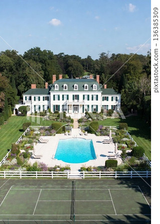 A mansion with a pool in the garden A mansion with a pool in the garden 136385309