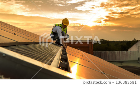 Engineer service check installation solar cell on the roof of factory. Engineer service check installation solar cell on the roof of factory. 136385581