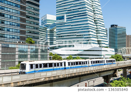 A train on the Wenhu or Brown Line of the Taipei MRT passes by the modern metropolis building in Nangang Software Park Area. A train on the Wenhu or Brown Line of the Taipei MRT passes by the modern metropolis building in Nangang Software Park Area. 136385840