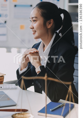 Lawyer explained to the client about the law that must be brought against the court case. Lawyer explained to the client about the law that must be brought against the court case. 136386390