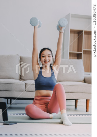 Young Asian sporty attractive people practicing yoga lesson with instructor. Asia group of women exercising healthy lifestyle in fitness studio. Sport activity, gymnastics or ballet dancing class. Young Asian sporty attractive people practicing yoga lesson with instructor. Asia group of women exercising healthy lifestyle in fitness studio. Sport activity, gymnastics or ballet dancing class. 136386478