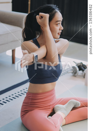Young Asian sporty attractive people practicing yoga lesson with instructor. Asia group of women exercising healthy lifestyle in fitness studio. Sport activity, gymnastics or ballet dancing class. Young Asian sporty attractive people practicing yoga lesson with instructor. Asia group of women exercising healthy lifestyle in fitness studio. Sport activity, gymnastics or ballet dancing class. 136386482