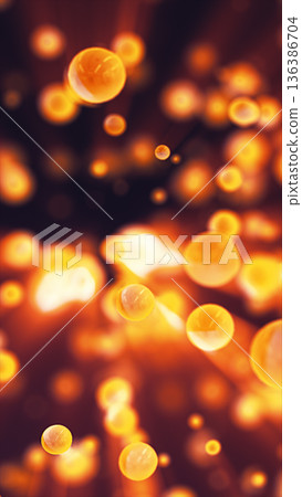 Soft glowing orange bokeh particles floating in an abstract space, creating a warm atmospheric background with depth and gentle motion 136386704