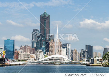 Panoramic view of the Dagang Bridge, 85 Sky Tower, and other buildings. The bridge connects Pier-2 Art Center and Peng-lai Commercial Harbor in Kaohsiung, Taiwan. 136387226