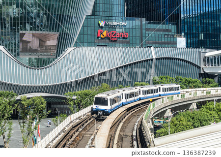 A train on the Wenhu or Brown Line of the Taipei MRT passes by the Mitsui Shopping Park LaLaport Taipei Nangang. A train on the Wenhu or Brown Line of the Taipei MRT passes by the Mitsui Shopping Park LaLaport Taipei Nangang. 136387239