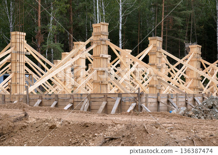 construction of a new house in the forest 136387474