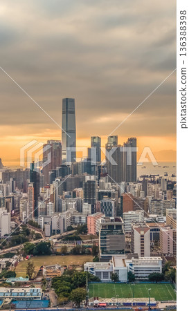 Feb 1 2026 Warm Sunset Illuminates Yau Tsim Mong Skyline And Harbour 136388398