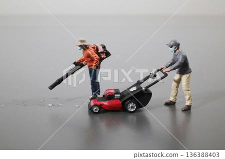 Miniature Workers Operate Leaf Blower And Lawn Mower Miniature Workers Operate Leaf Blower And Lawn Mower 136388403