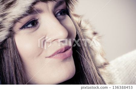 Young lady in winter hat 136388453