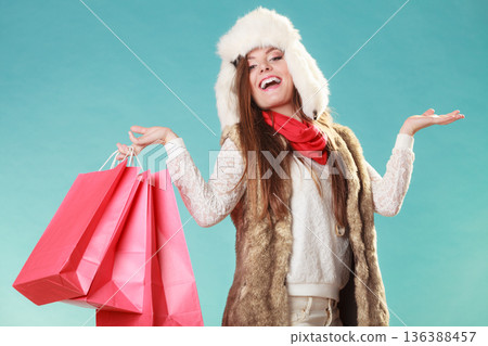 Woman with bags shopping. and empty hands. 136388457