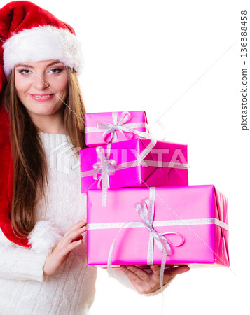 Woman santa helper hat with many pink gift boxes Woman santa helper hat with many pink gift boxes 136388458