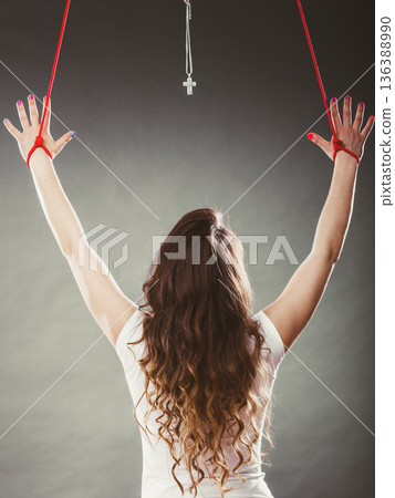 Tied woman forced to worship. Fake faith religion. Tied woman forced to worship. Fake faith religion. 136388990