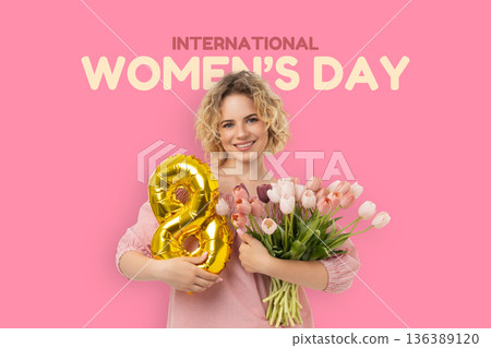 Woman holds flowers and a balloon for a special day 136389120