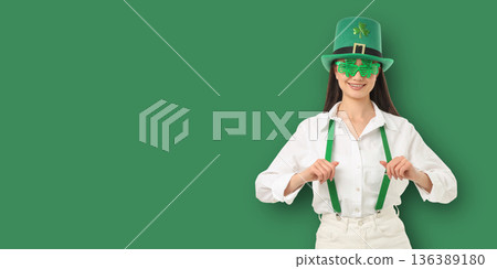 A young woman is dressed in green for St. Patrick's Day A young woman is dressed in green for St. Patrick's Day 136389180