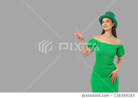 A woman in a green dress joyfully celebrates St. Patrick's Day 136389183