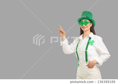 Woman in green costume celebrates St. Patrick's Day Woman in green costume celebrates St. Patrick's Day 136389189