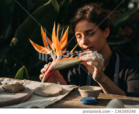 Crafting with blooming exotic flower in a garden environment during the afternoon light Crafting with blooming exotic flower in a garden environment during the afternoon light 136389298