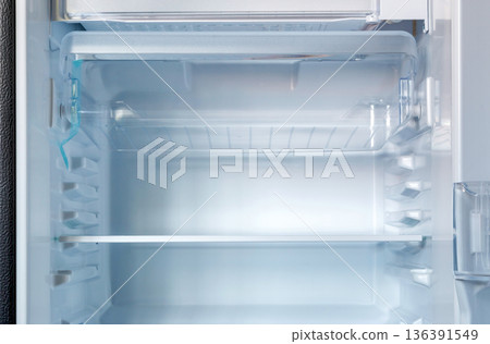 new modern refrigerator opens to reveal the inside, empty refrigerator new modern refrigerator opens to reveal the inside, empty refrigerator 136391549