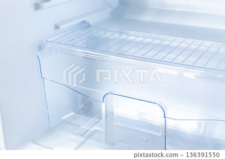 new modern refrigerator opens to reveal the inside, empty refrigerator new modern refrigerator opens to reveal the inside, empty refrigerator 136391550