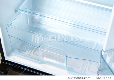 new modern refrigerator opens to reveal the inside, empty refrigerator new modern refrigerator opens to reveal the inside, empty refrigerator 136391553
