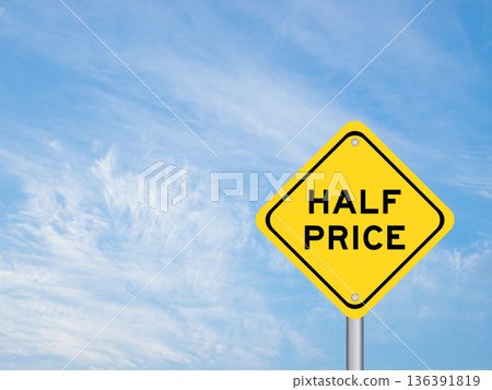 Yellow transportation sign with word half price on blue color sky background Yellow transportation sign with word half price on blue color sky background 136391819