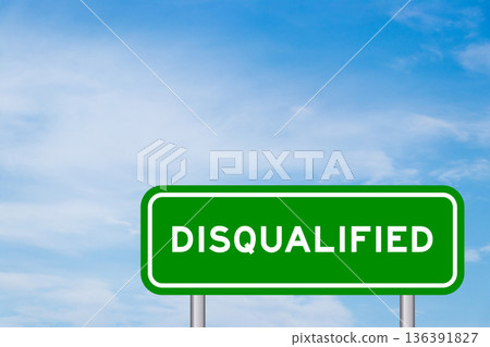 Green color transportation sign with word disqualified on blue sky with white cloud background 136391827